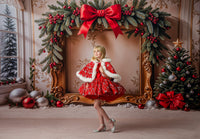 Studio portrait of a child in the holiday gown, highlighting vintage lace trim and puff sleeve silhouette.

