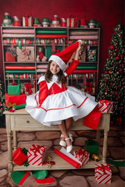 Girl wearing a elf themed dress for Christmas Photography 