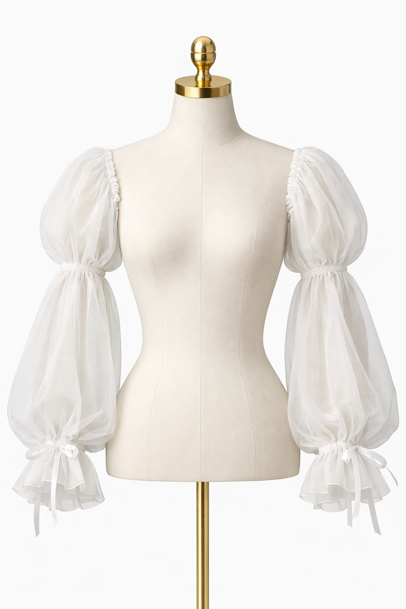 Detachable puff bishop tulle sleeves displayed on a neutral dress form mannequin in a fine art studio setting