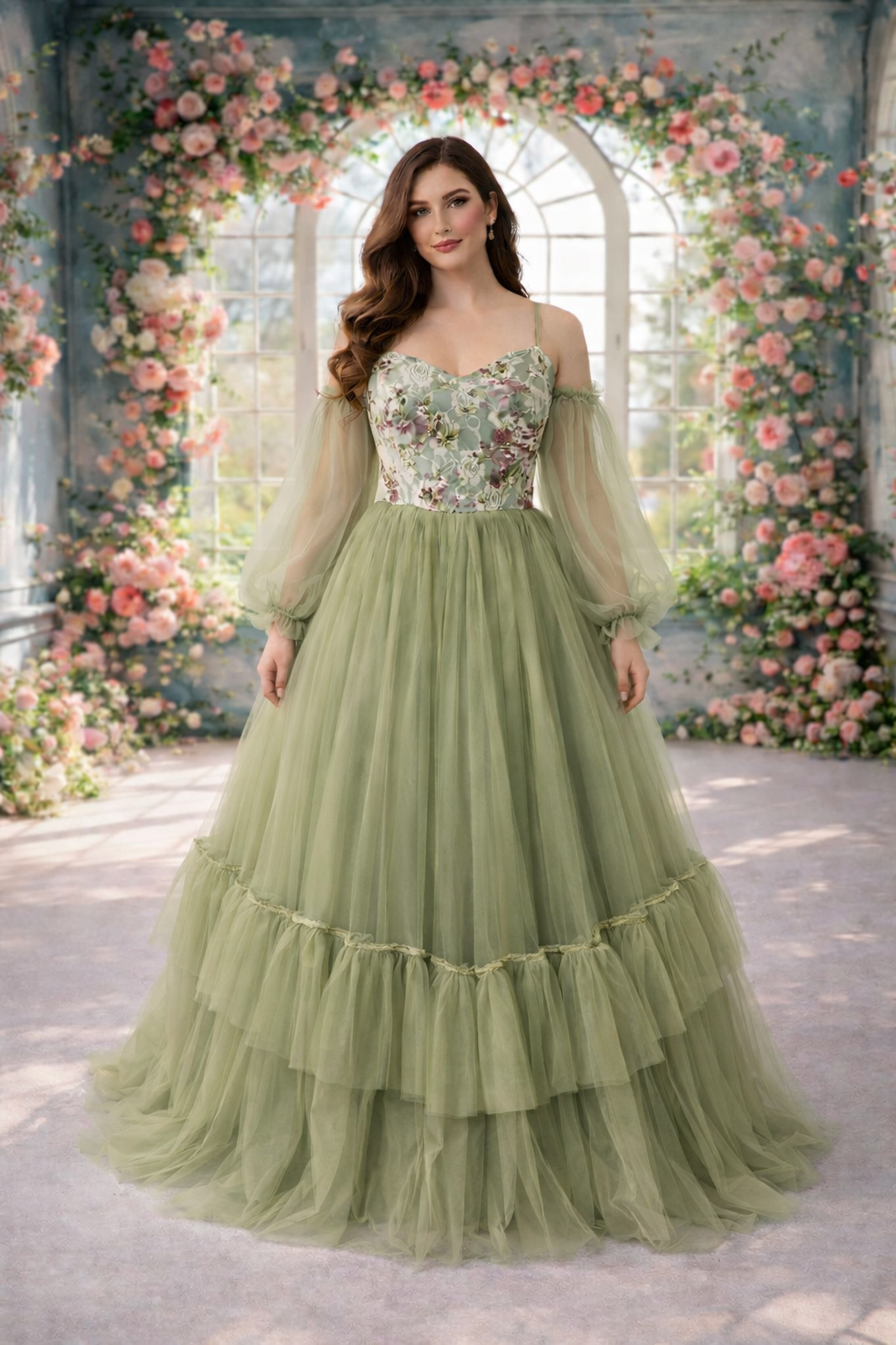 Woman in a green and floral off-shoulder gown standing in front of a floral arch.