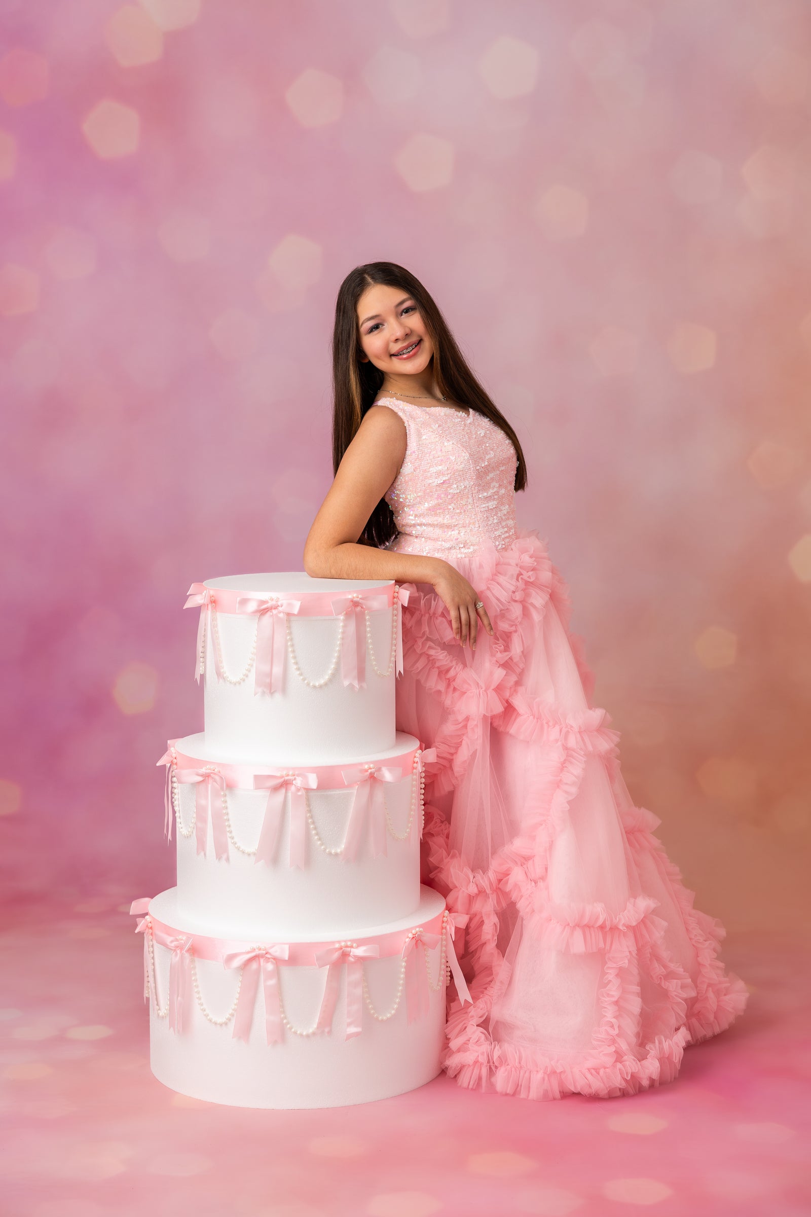 Girl wearing a custom birthday gown for a milestone portrait