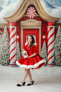 Portrait of young girl in vintage-inspired Christmas gown with red accents

