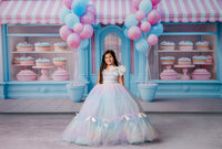Twirling motion shot of a child in the Colorful Bliss Gown, emphasizing the fullness and floaty silhouette of the tulle skirt.

