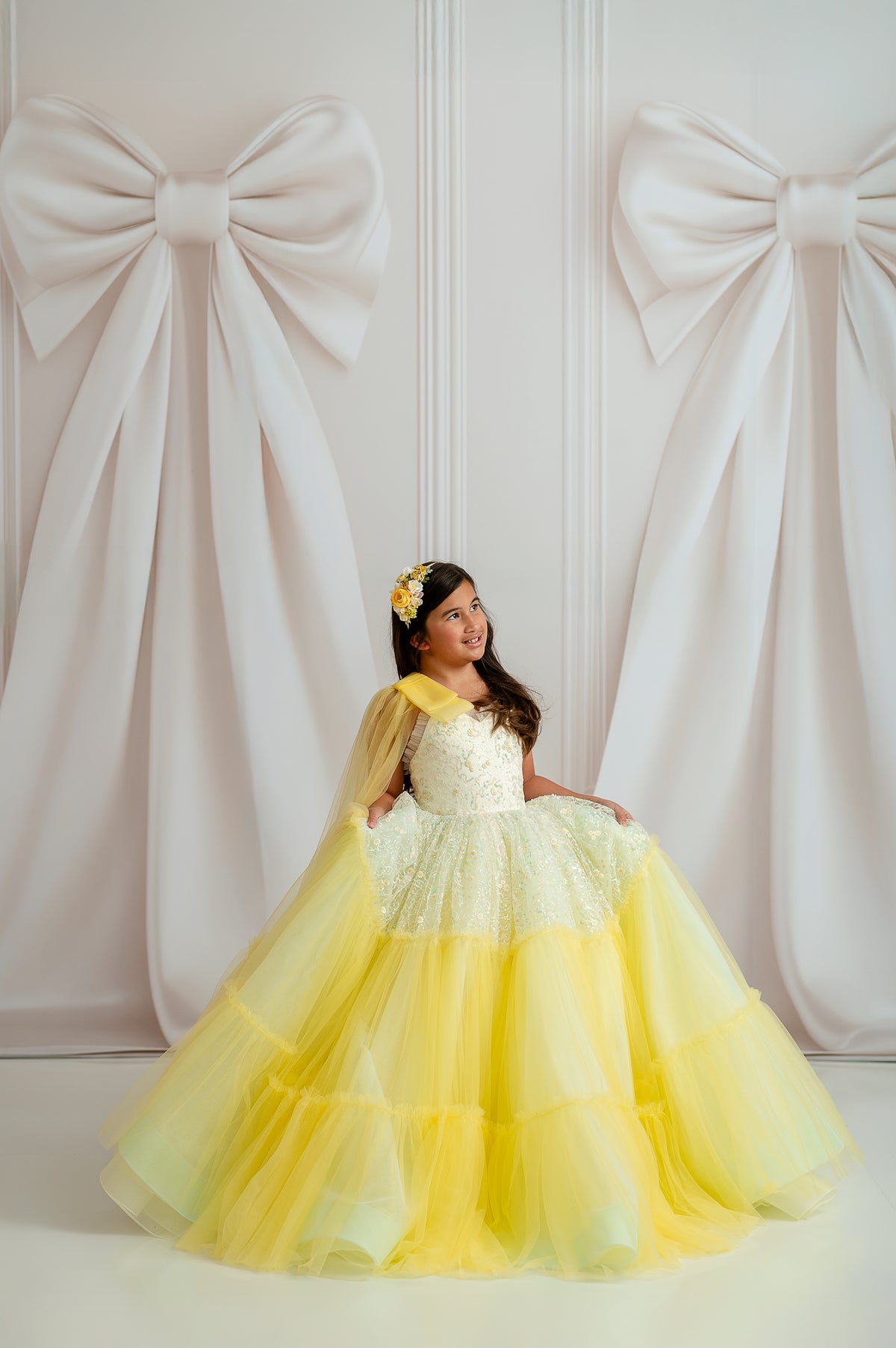 Girl wearing Harmony gown with sequined floral bodice and ombré tulle skirt

