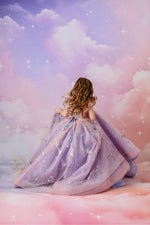 "A magical portrait of a girl in a flowing pink and lavender dress, perfect for a fantasy-themed photoshoot."

