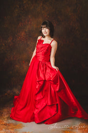 Glamorous red satin evening gown embellished with shimmering sequins.