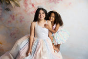 Pastel ombré Aurora Gleam Gown styled with a floral crown for a dreamy photoshoot look

