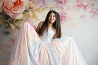 Child wearing the Aurora Gleam Gown in natural light, showcasing shimmering pastel tones

