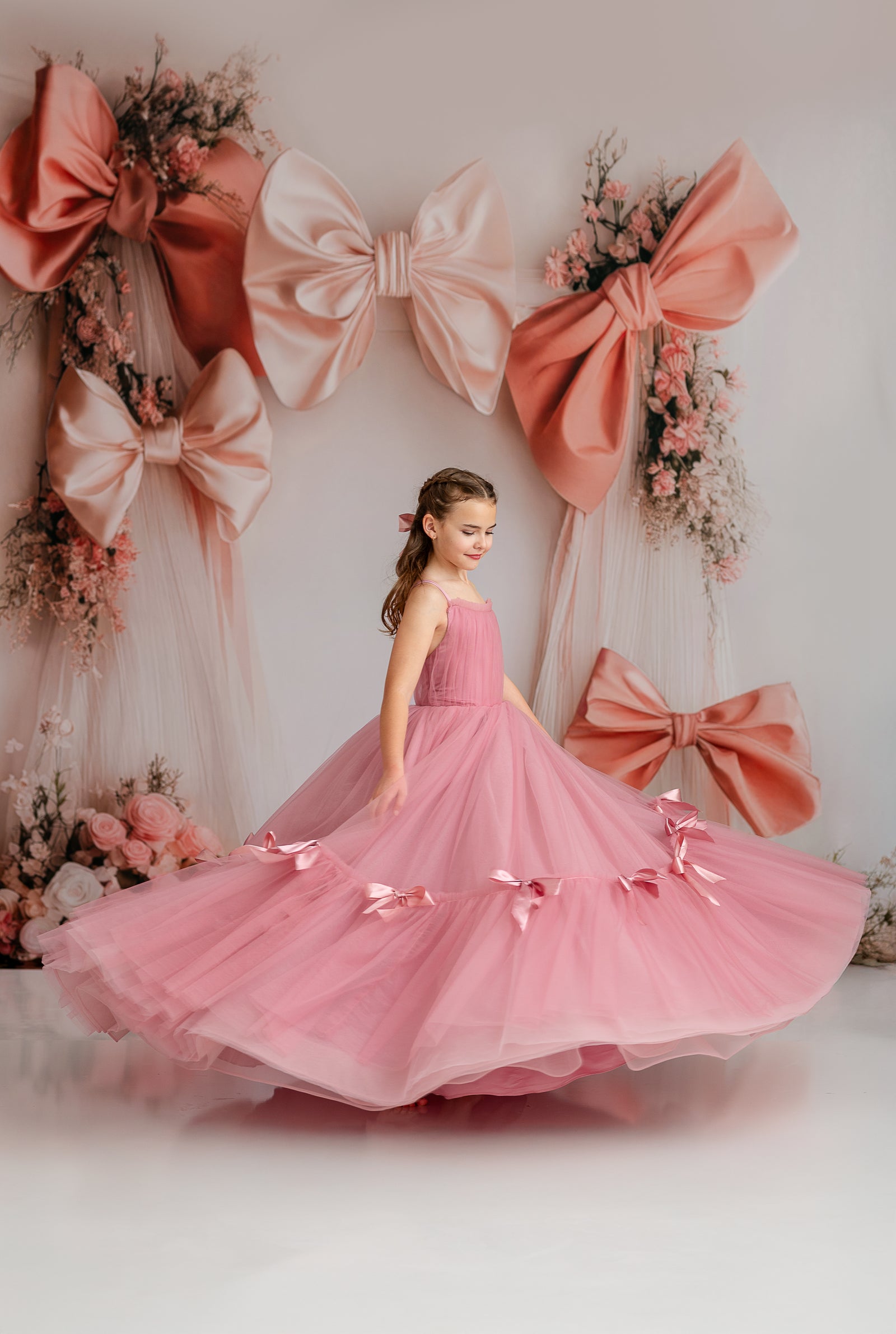 "Bows of Grace gown featuring a flattering sweetheart neckline and elegant bow details."
