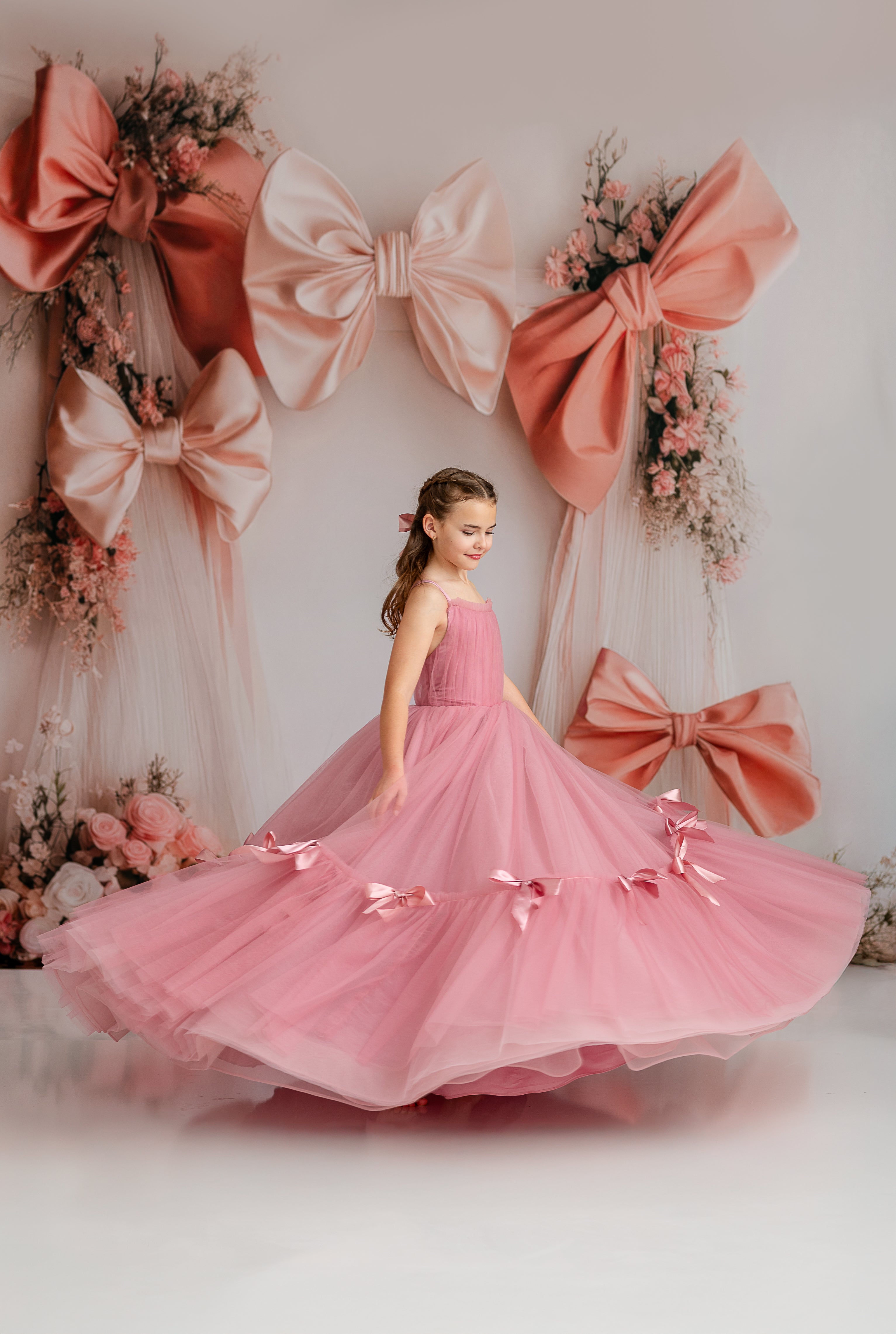 "Bows of Grace gown featuring a flattering sweetheart neckline and elegant bow details."
