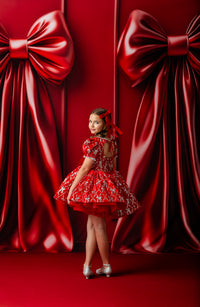 Back view of the puffed skirt showing silver bow embroidery and full twirl effect in the Velvet Whimsy Bows Dress.

