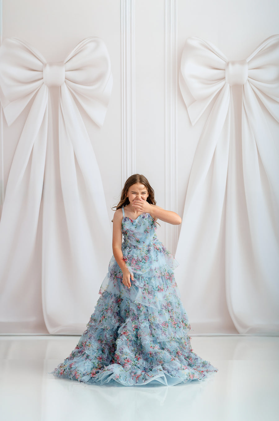 Close-up of chiffon puff sleeves with delicate bows on Fancy Mae gown

