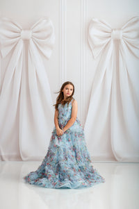 Floor-length soft blue floral gown with adjustable shoulder ties

