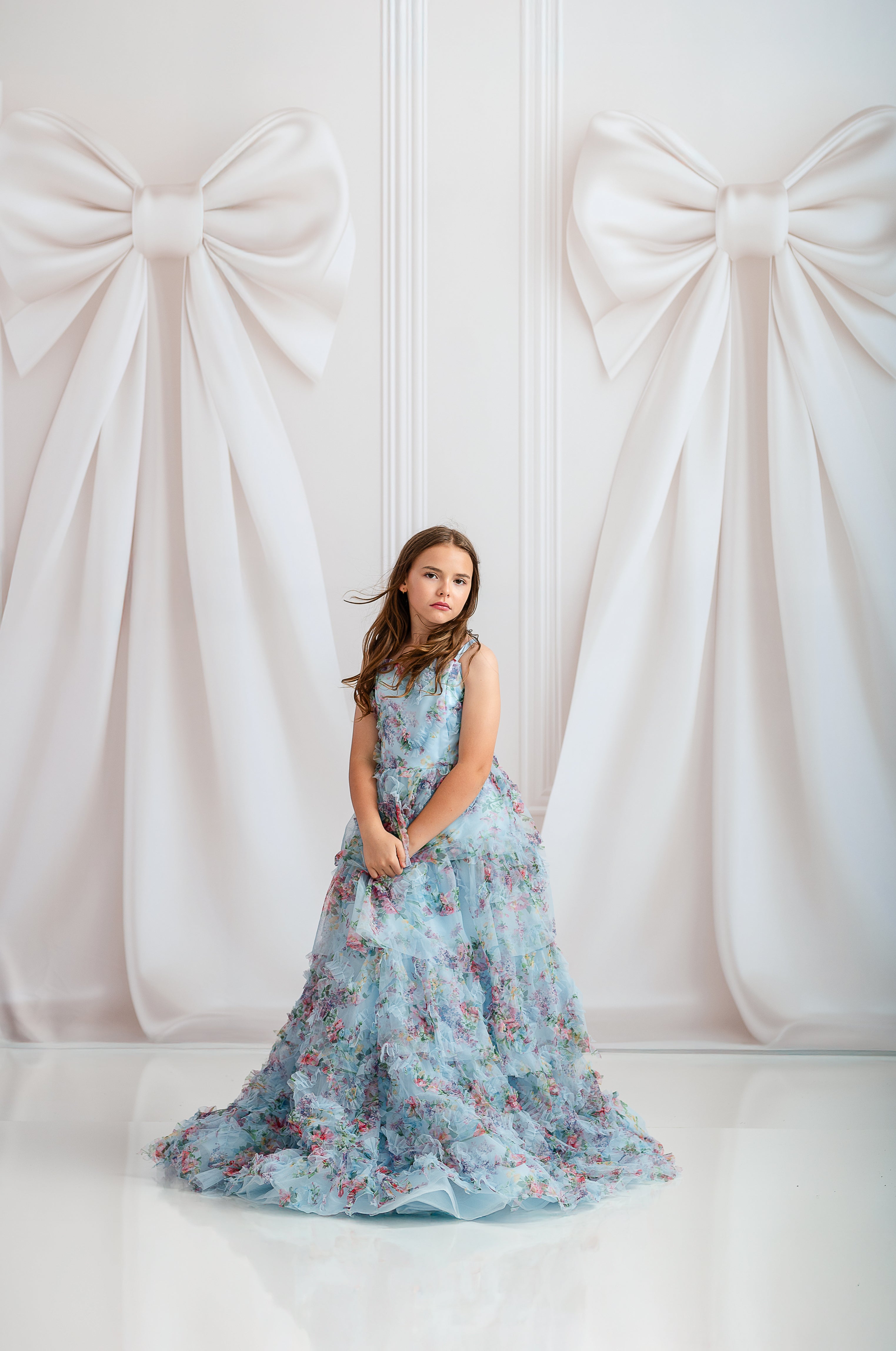Floor-length soft blue floral gown with adjustable shoulder ties


