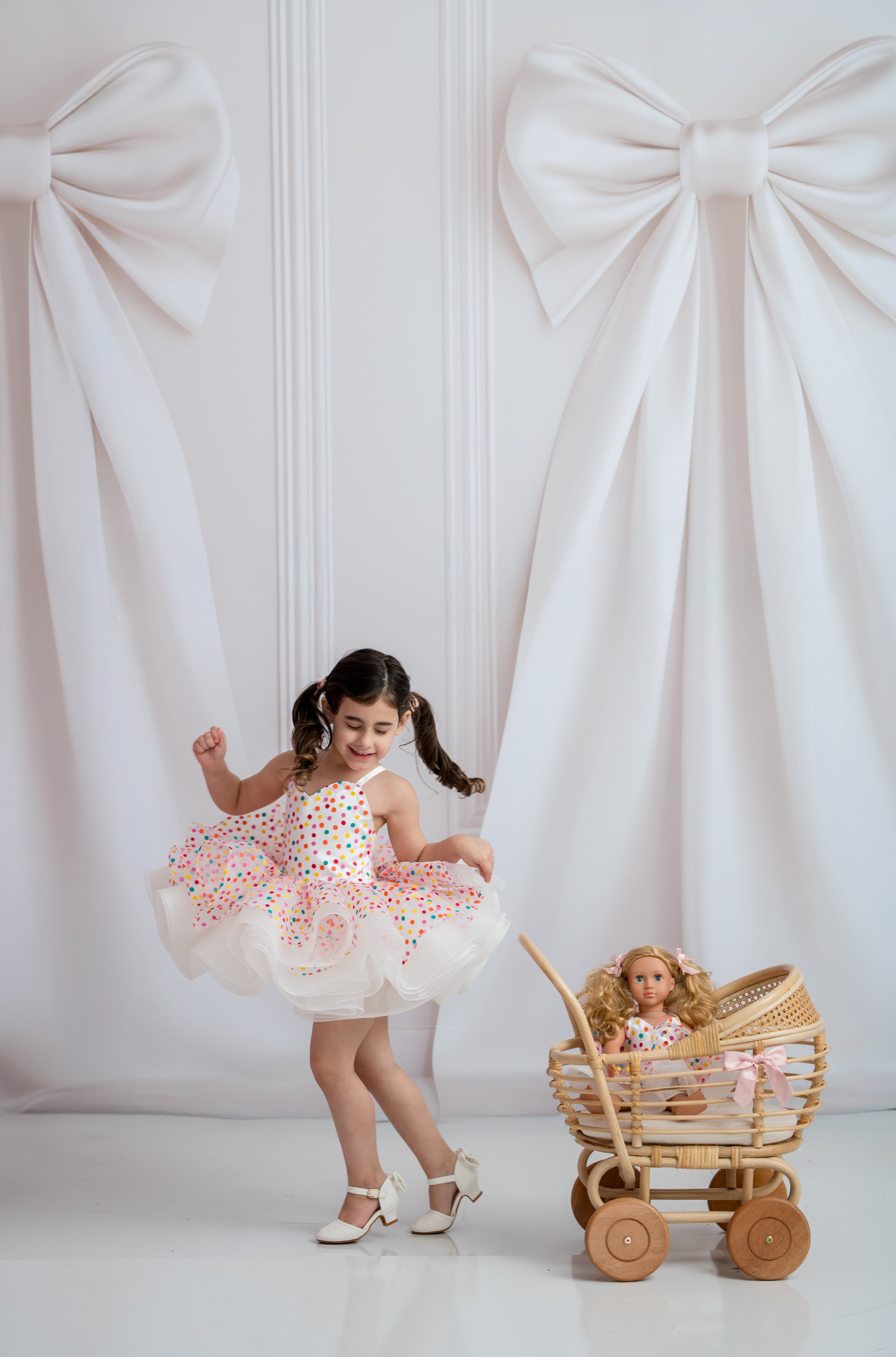 Colorful polka dot girls dress styled on dress form for product photography
