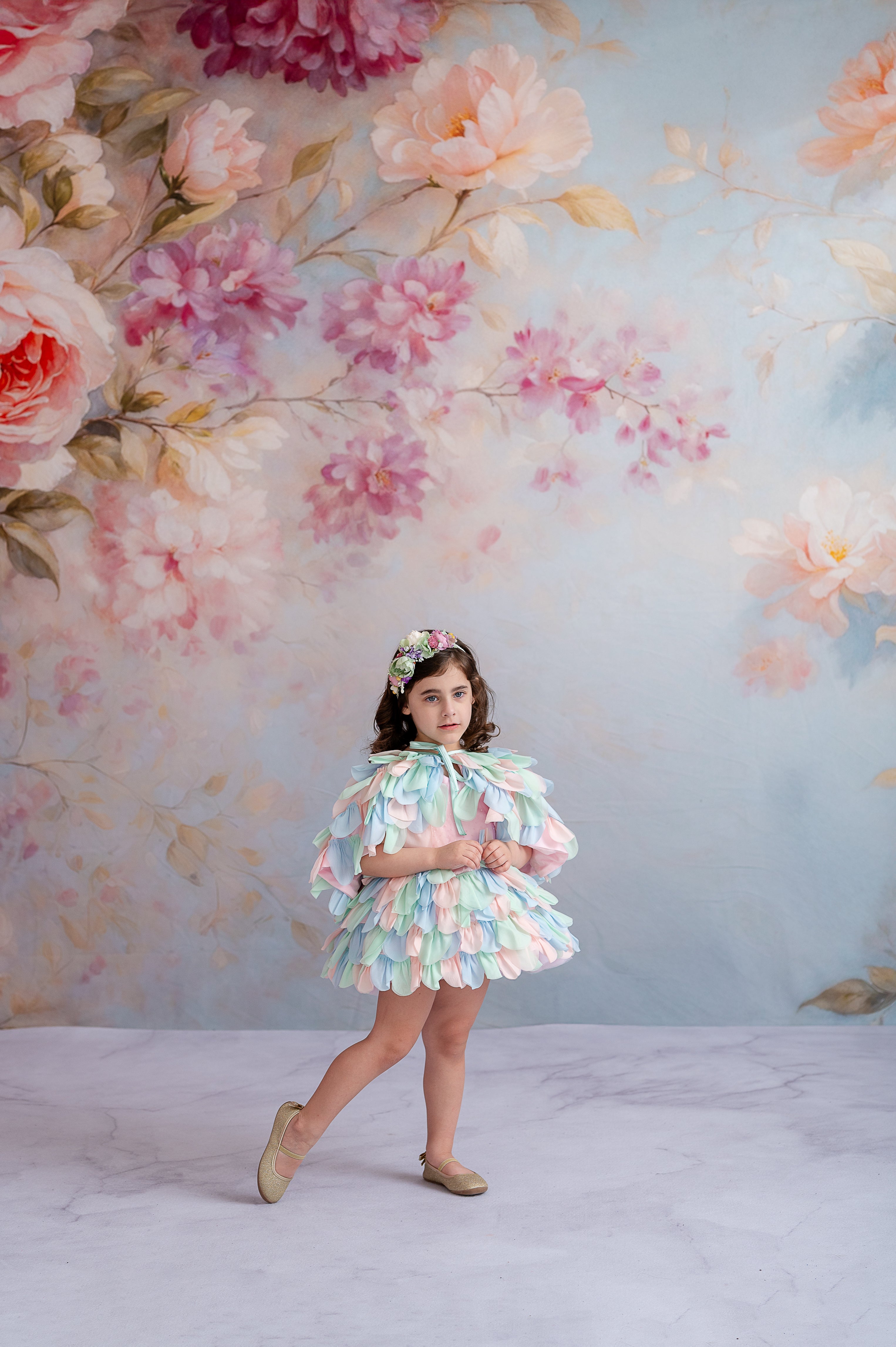 "Soft and dreamy portrait of a girl in a pastel-themed couture dress."
