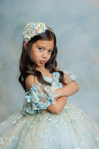 "Flowing peplum skirt detail on couture Trésor Caché gown ideal for photoshoots"

