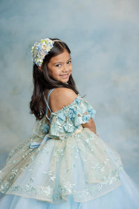 "Highlighted view of flouncy peplum skirt on romantic Trésor Caché gown"

