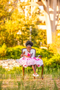 girl wearing pink velvet dress