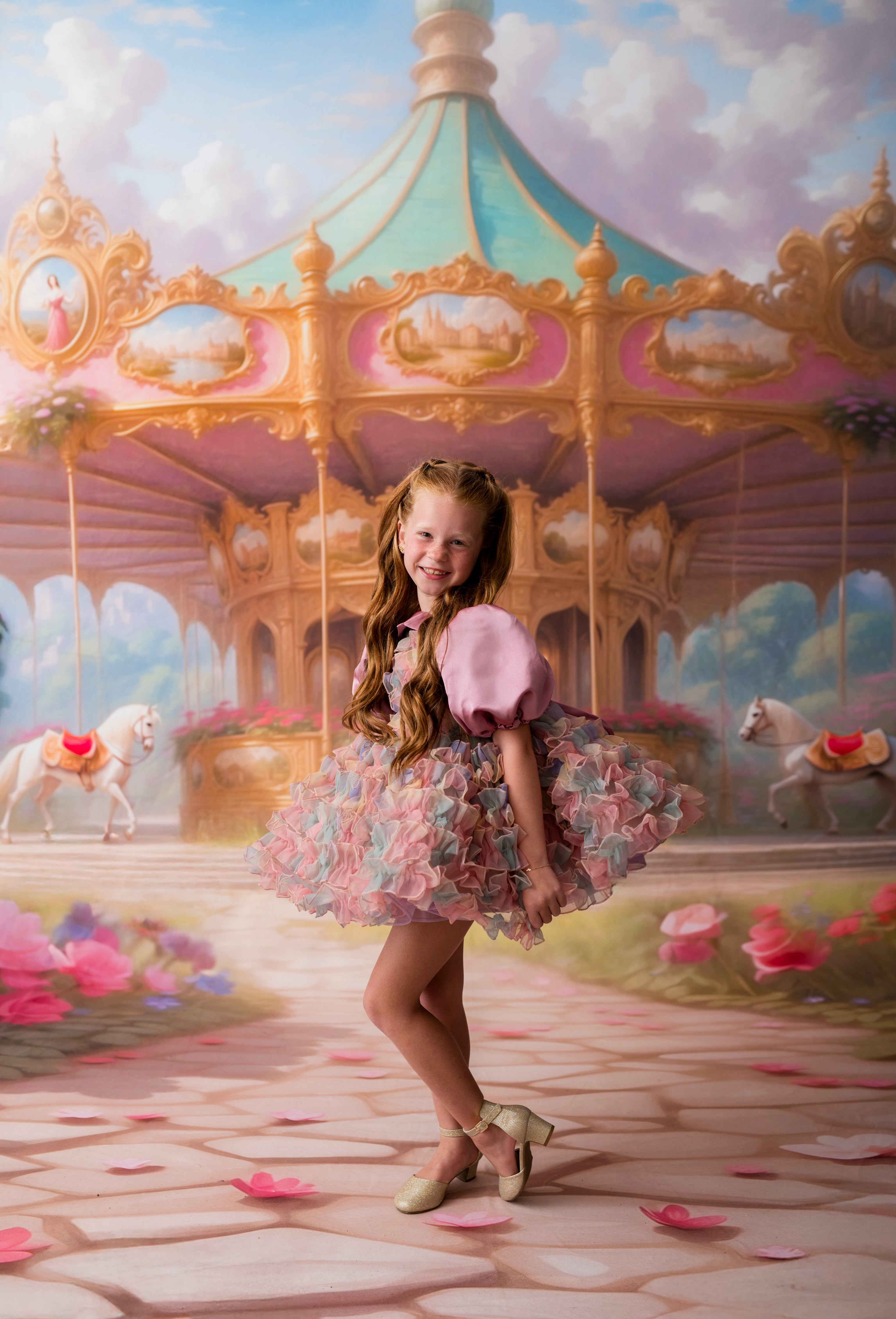 Young girl in a colorful dress standing in front of a carousel with a fantasy setting.