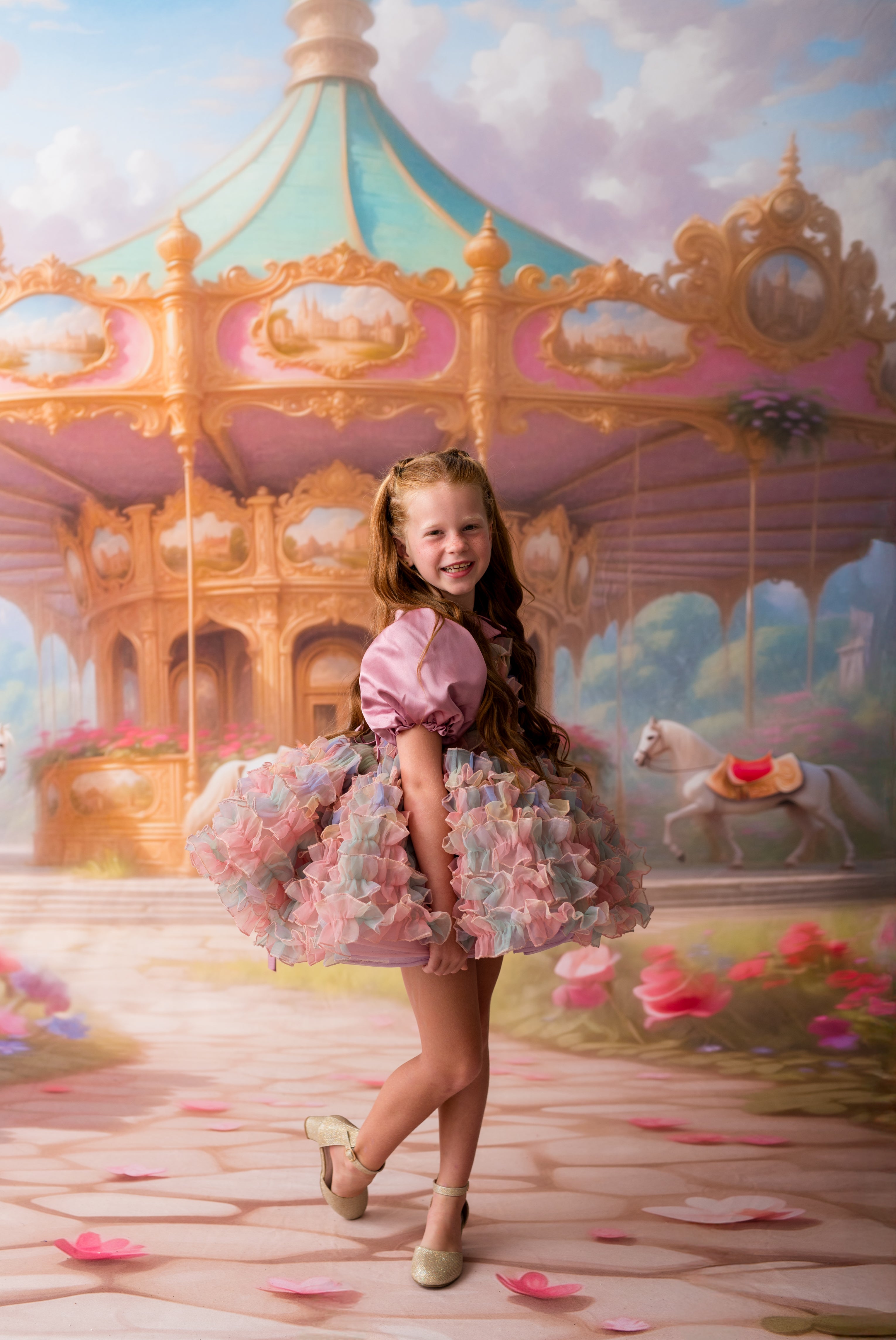 Young girl in a colorful dress standing in front of a carousel with a fantasy background