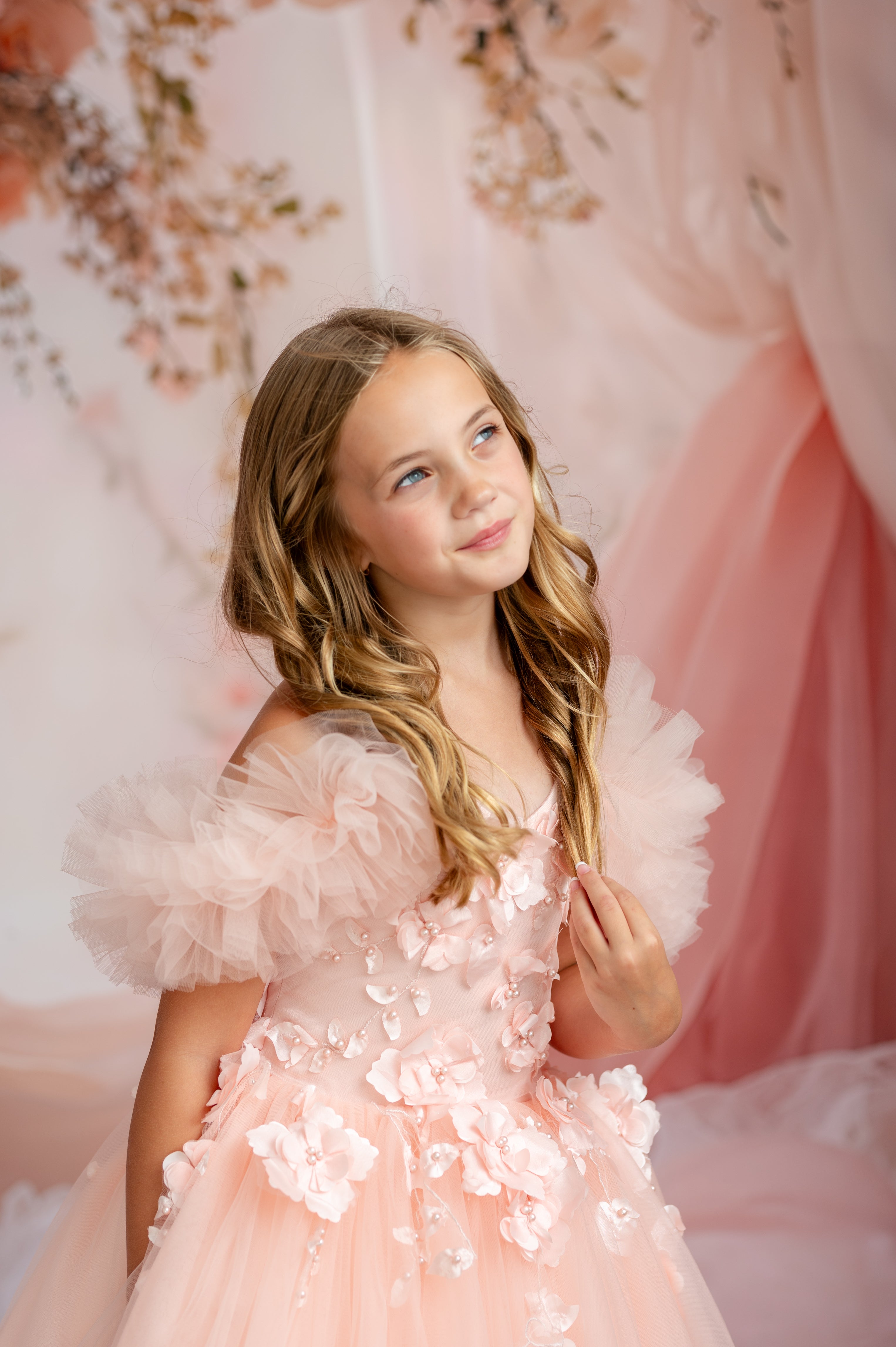 "Romantic peach children’s gown for milestone photography and special occasions"