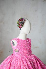 "Stylish Retro Pink Candy Dress with sparkly sequins and optional puff sleeves, perfect for ages 6-7."

