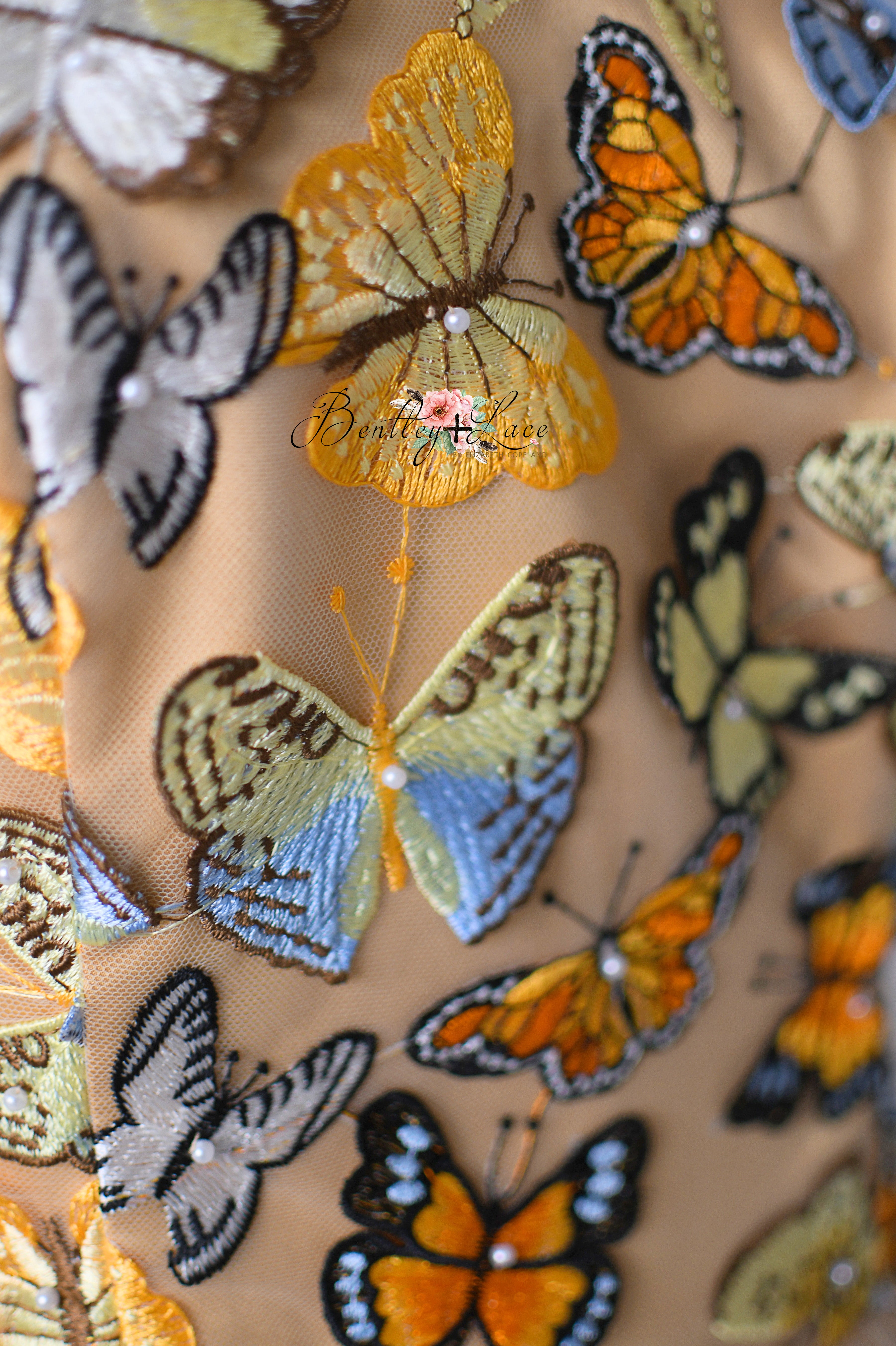 Dreamy dress with fluttering butterfly details and a flowing skirt fit for an enchanted garden scene.





