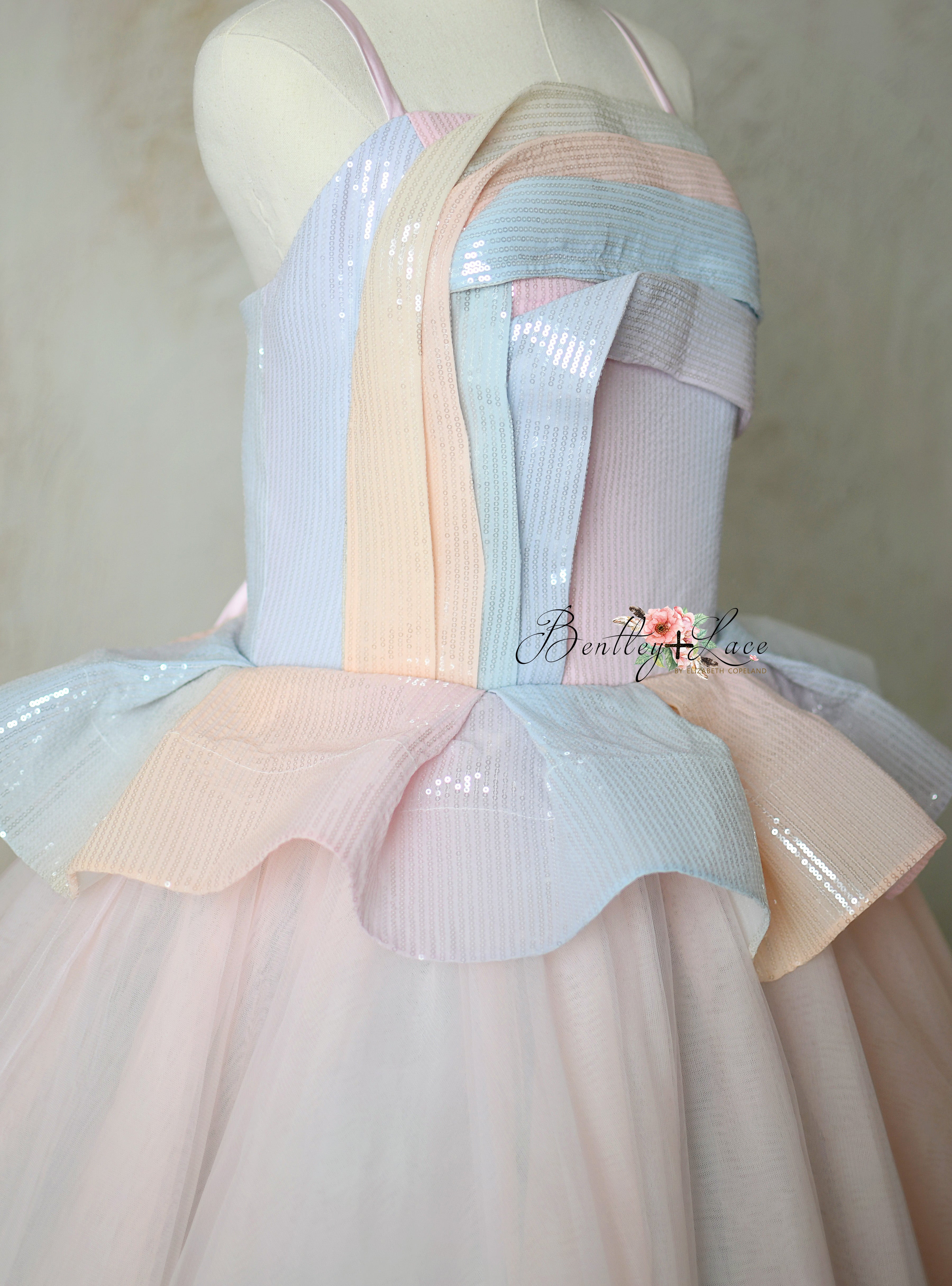 Elegant ombre pastel tulle skirt of Prism of Dreams gown with ruffled pleat bodice.
