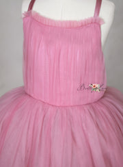 The Bows of Grace floor-length gown featuring intricate hand-sewn bows and satin accents, perfect for special occasions.
