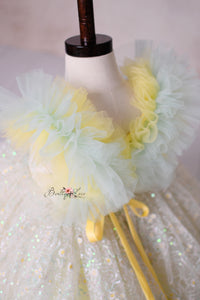 Golden shimmer and floral lace make the Harmony Gown a must-have for enchanting photography sessions.

