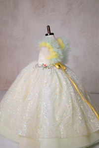 Let your little one shine in the Harmony Gown, a couture masterpiece with delicate lace, ethereal pastels, and a dreamy full skirt.

