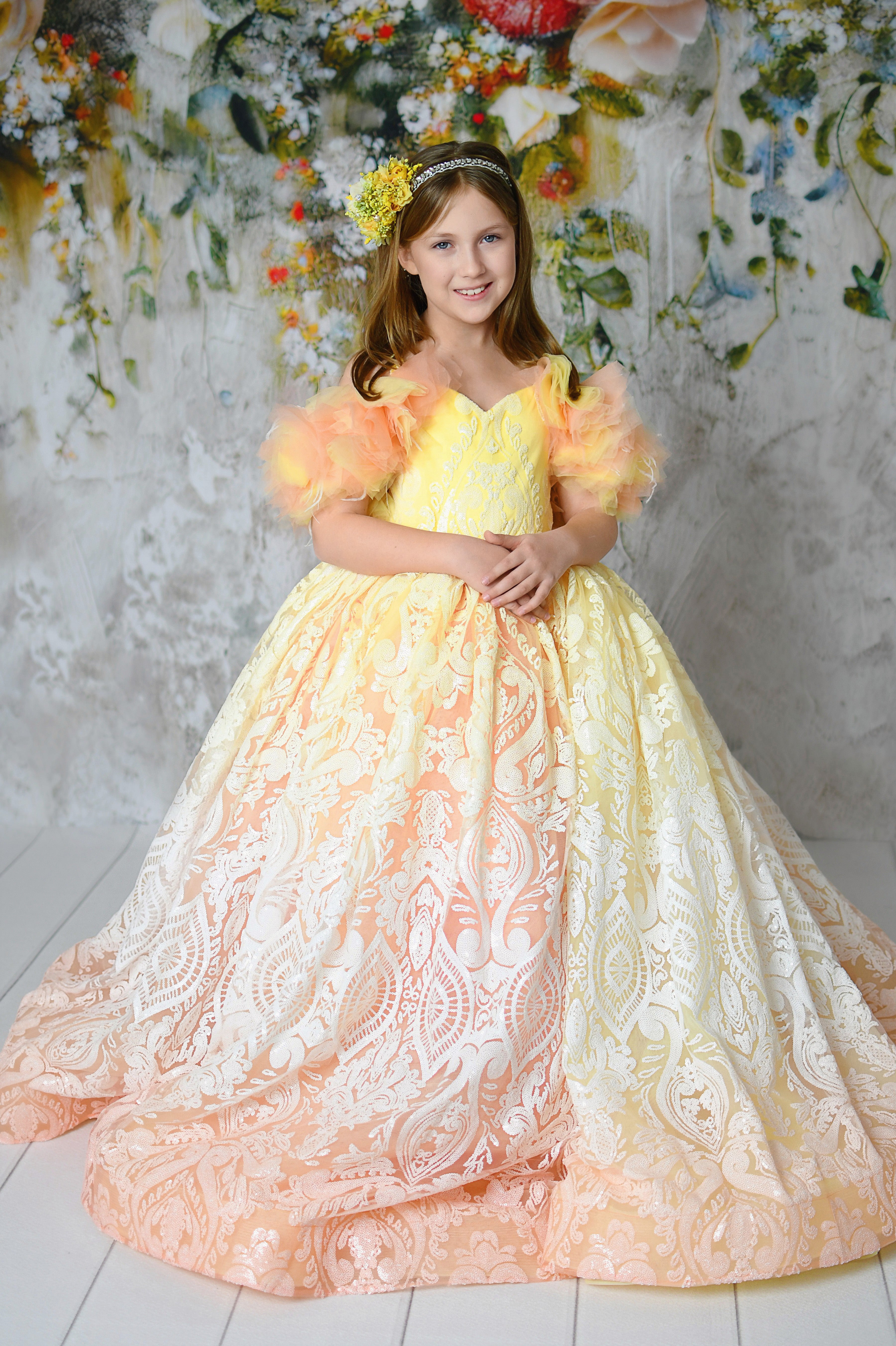 Elegant "Sugar Kisses" coral and yellow floor-length gown with lace overlay.
