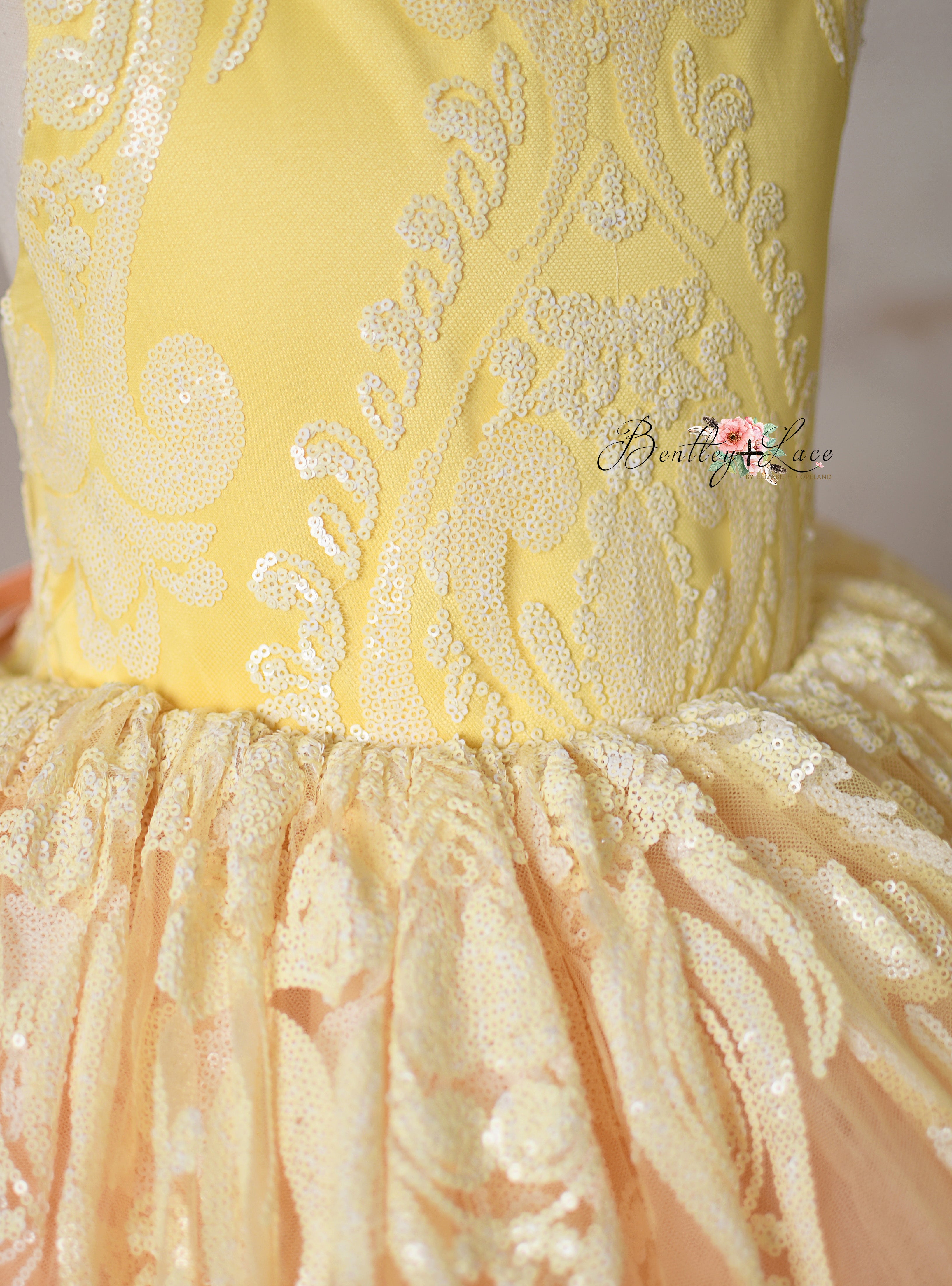 Side angle of the "Sugar Kisses" dress highlighting its luxurious fabric.
