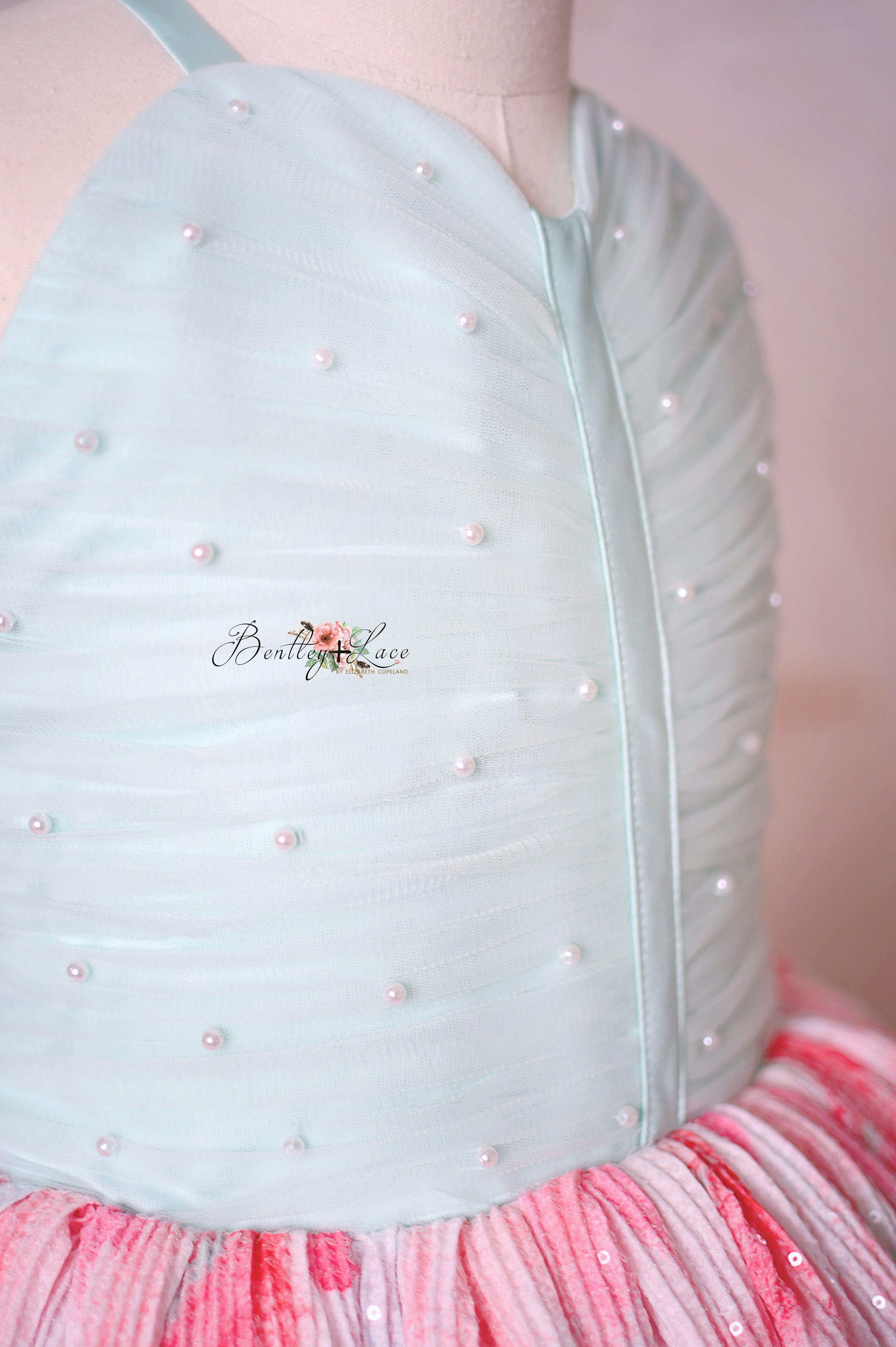 "Cotton Candy Dream gown styled with a floral hairpiece, perfect for a whimsical photoshoot."
