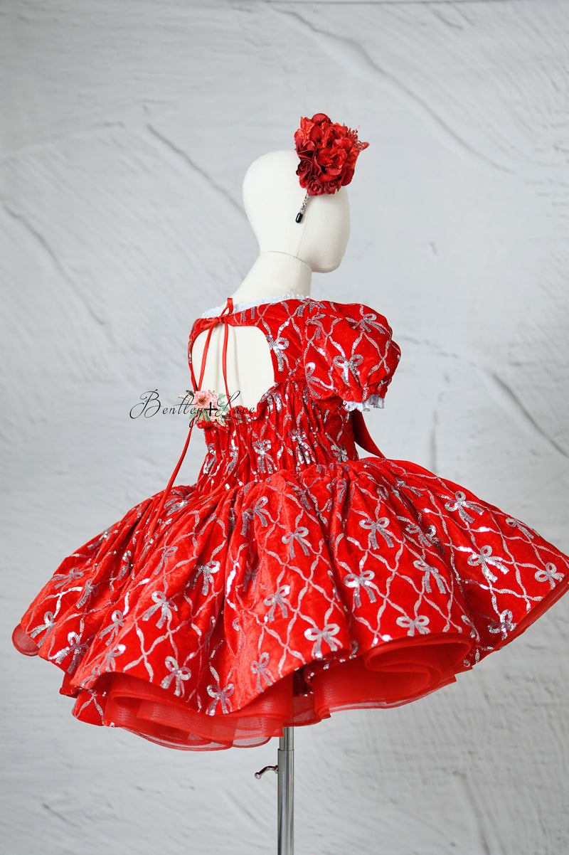 Red and silver girl's gown perfect for Christmas photos and styled shoots.

