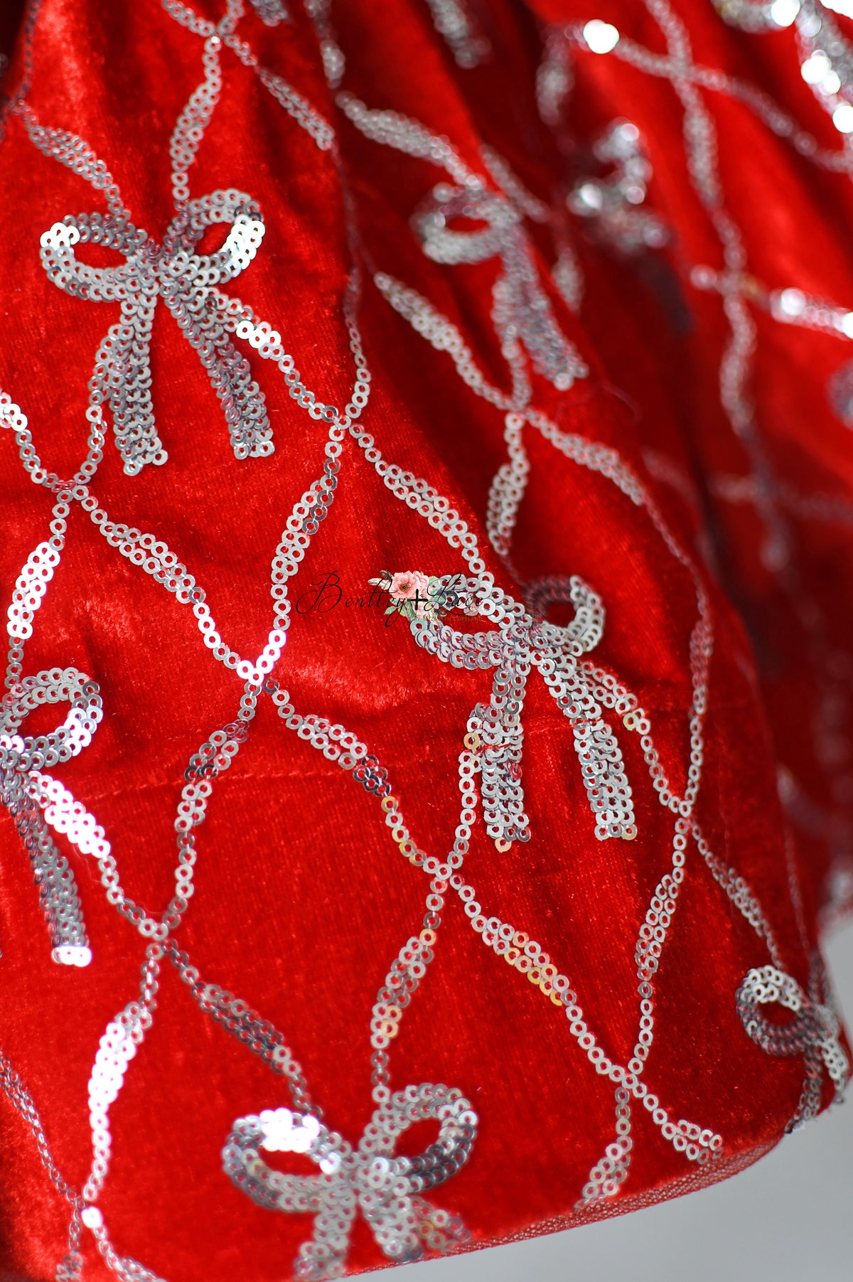 High-end couture holiday dress for styled photo sessions and winter celebrations.

