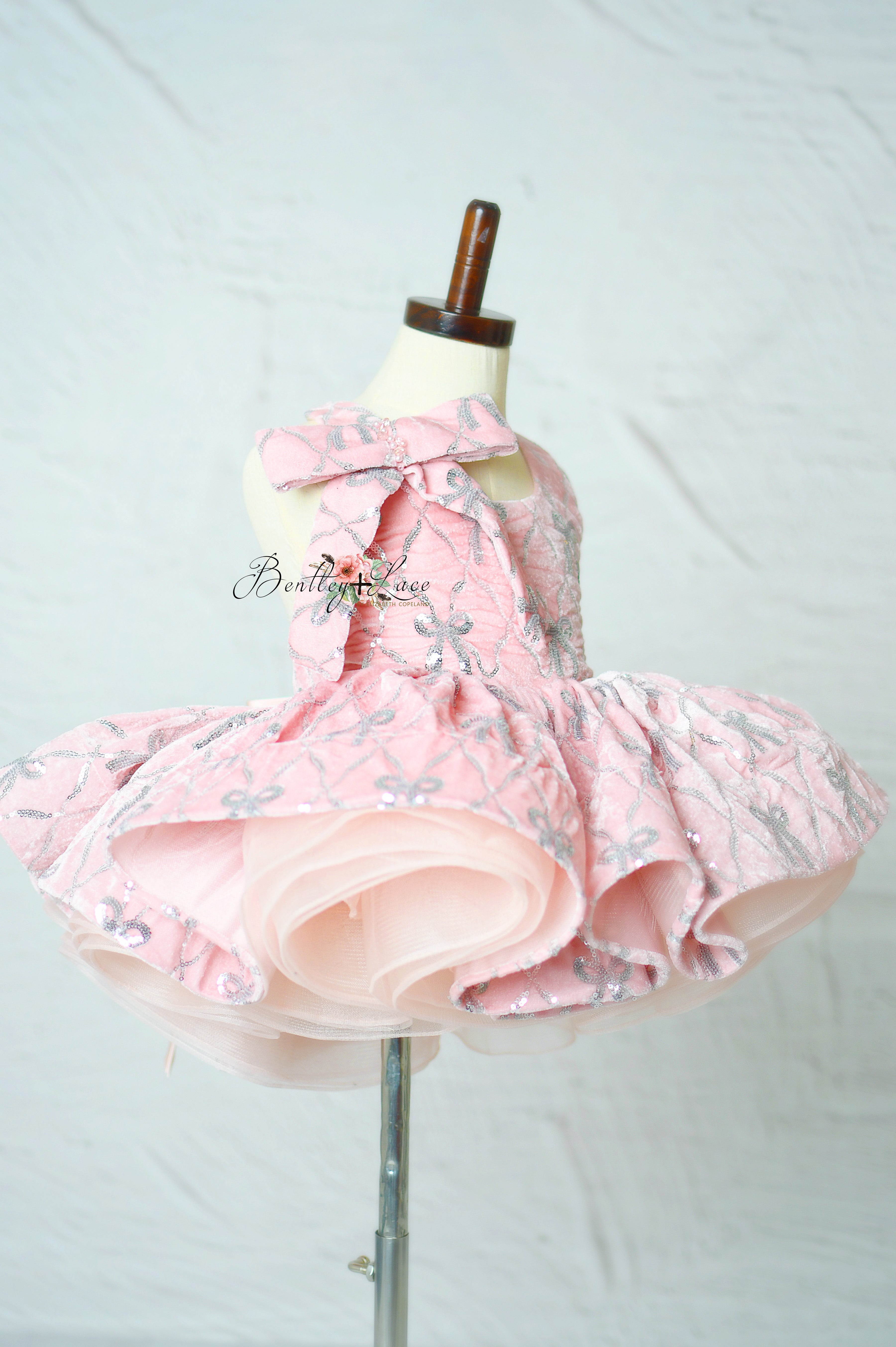 "Bentley + Lace Velvet Whimsy Bows Apron Dress on mannequin"

