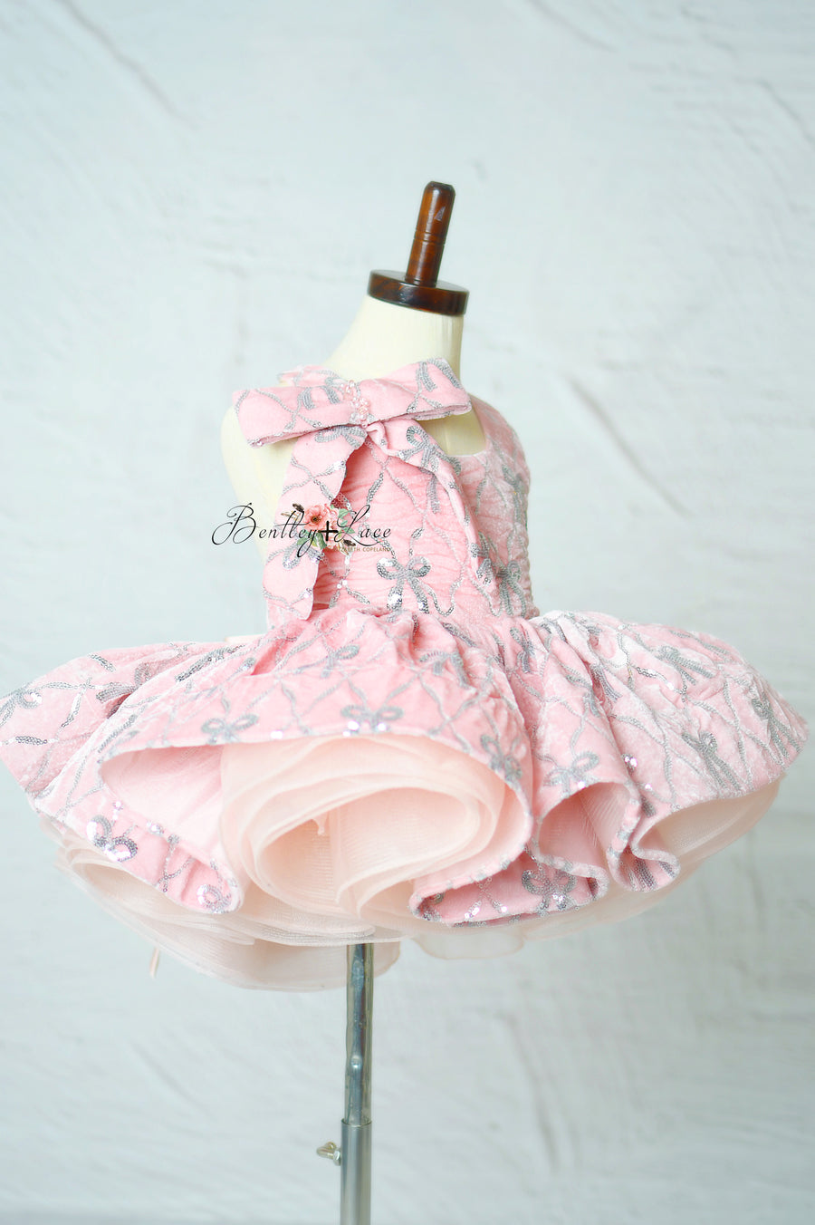 "Bentley + Lace Velvet Whimsy Bows Apron Dress on mannequin"

