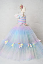 Close-up of the Colorful Bliss Gown’s rainbow swiss dot fabric, capturing its whimsical texture and vibrant, joyful color palette.

