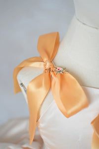 “Back view of Clementine Dreams petal-length gown with layered tulle skirt”

