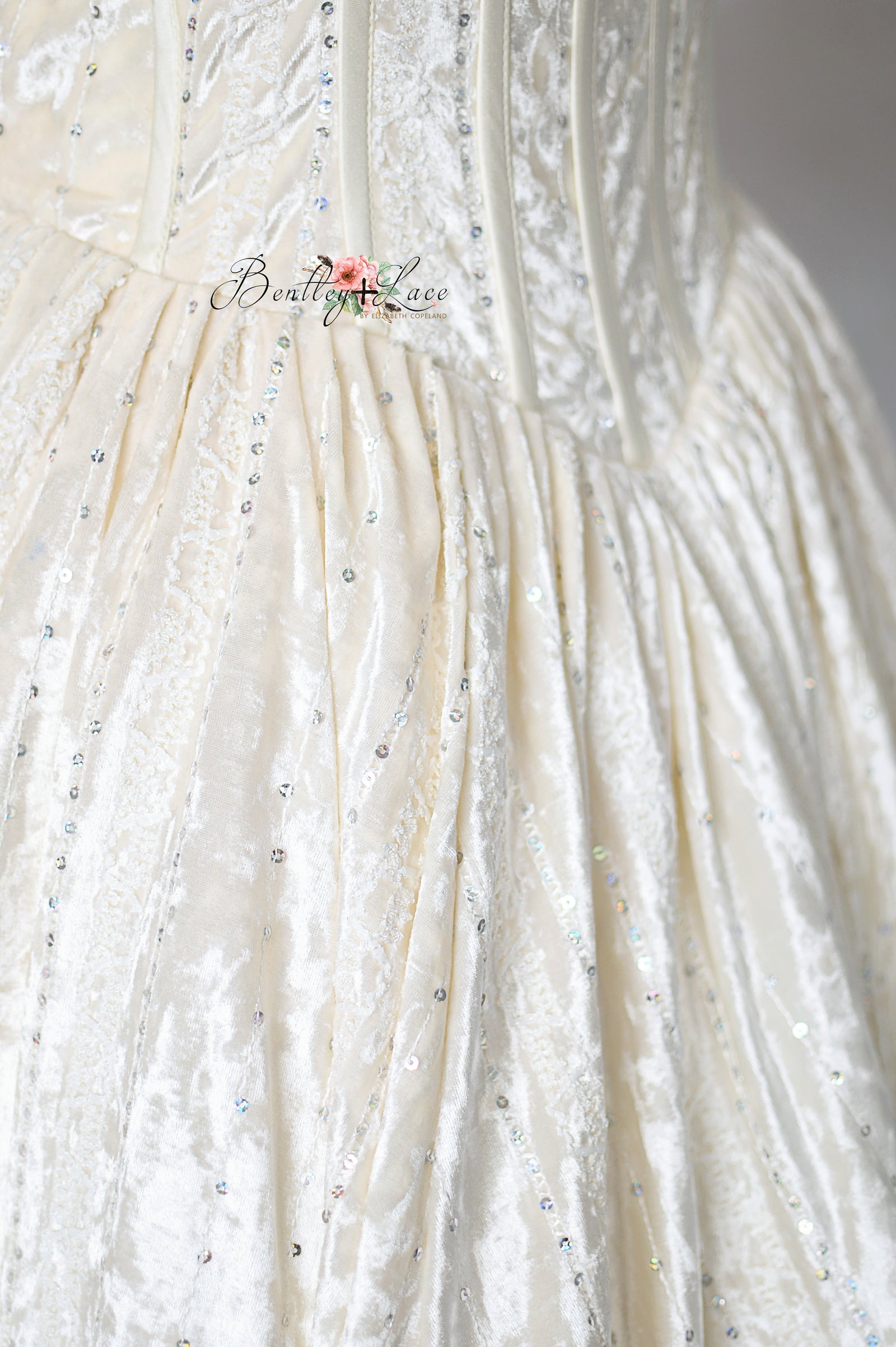 Close-up of intricate bodice detailing and fine stitching

