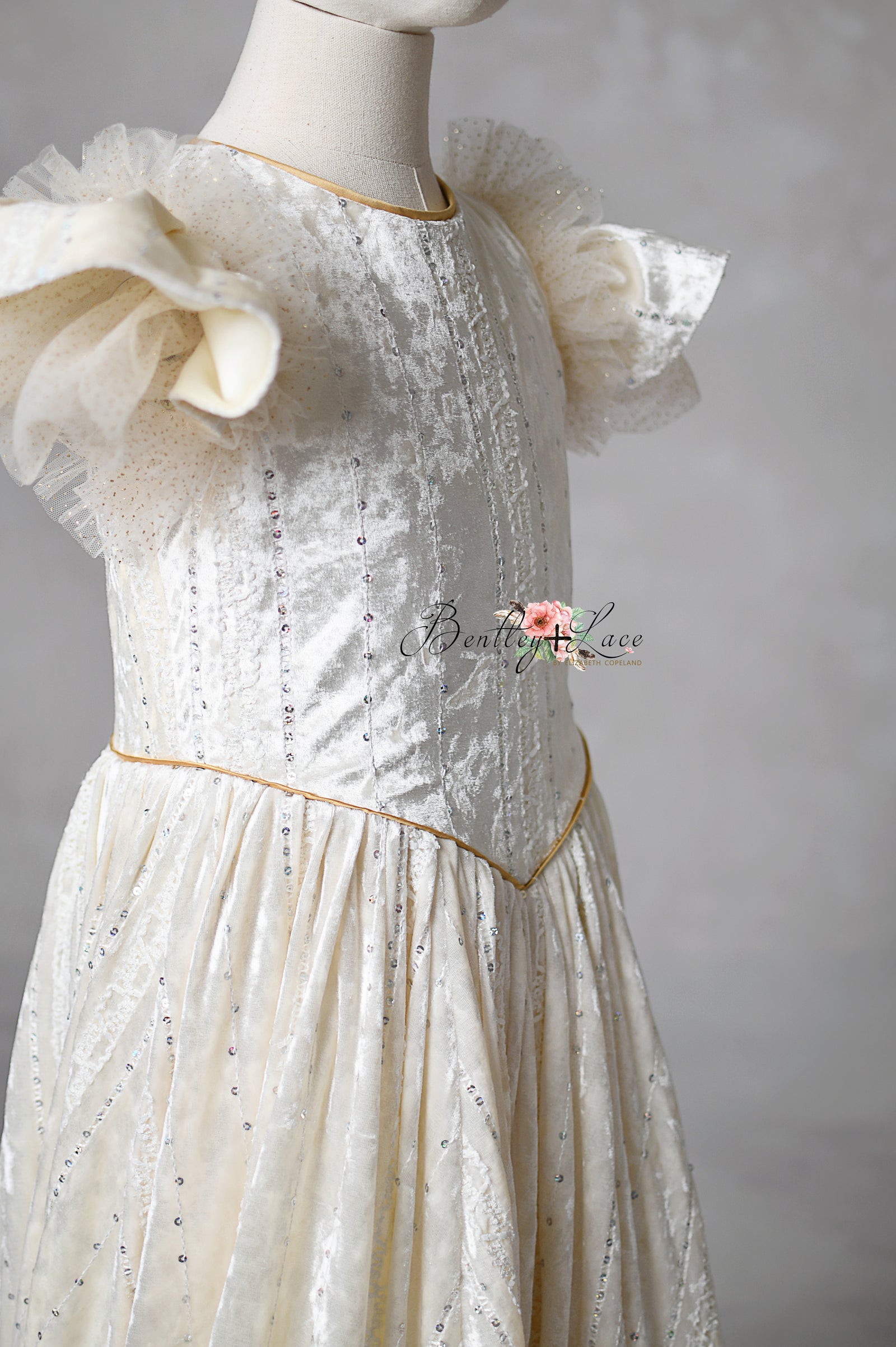 Clara’s Dream gown on holiday set with vintage-inspired backdrop

