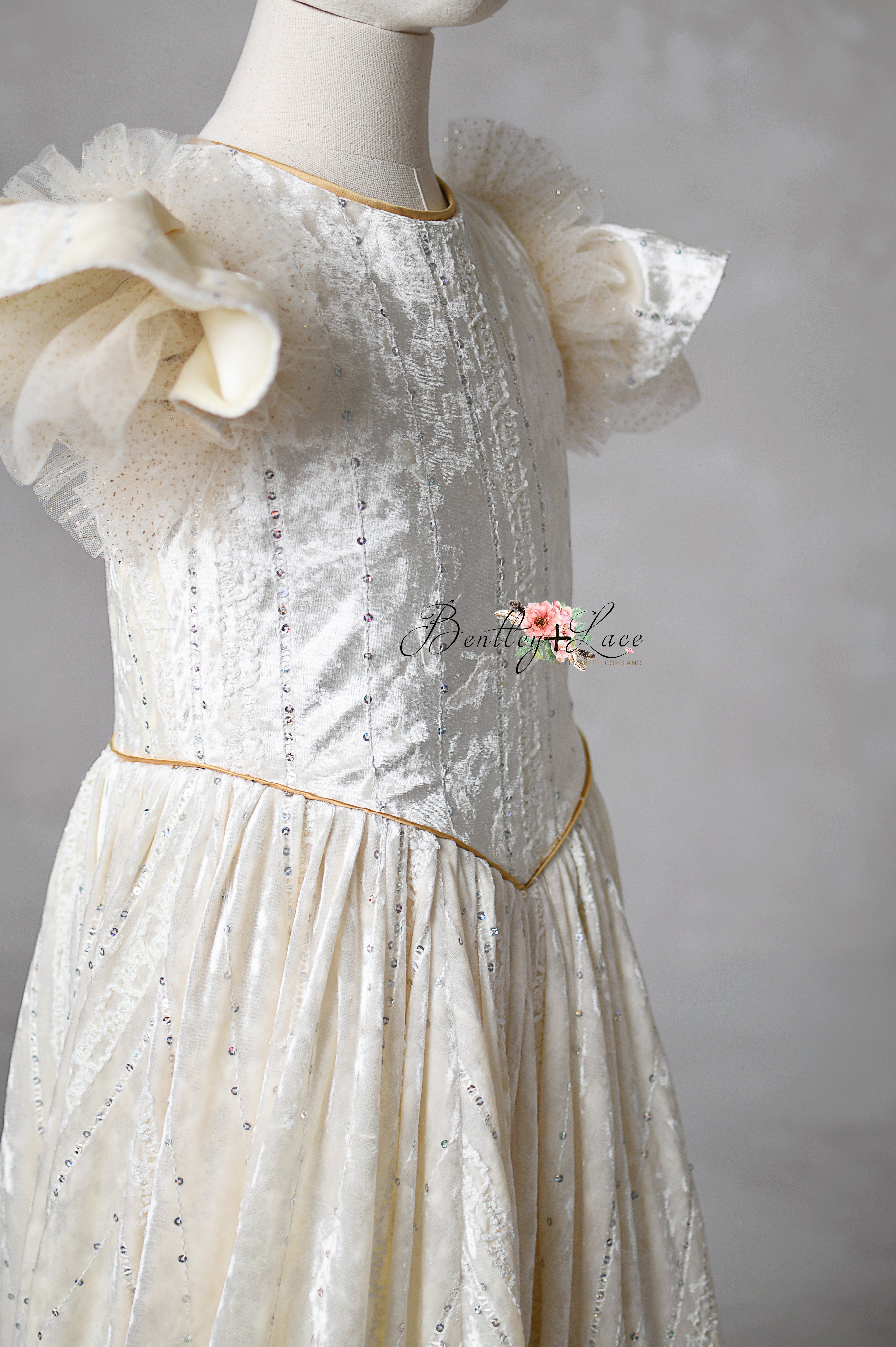 Clara’s Dream gown on holiday set with vintage-inspired backdrop

