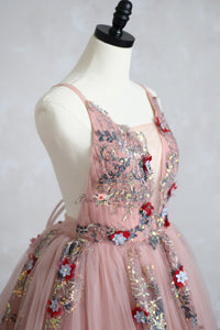 A mother and daughter wearing matching elegant gowns, ideal for photography sessions and special occasions.