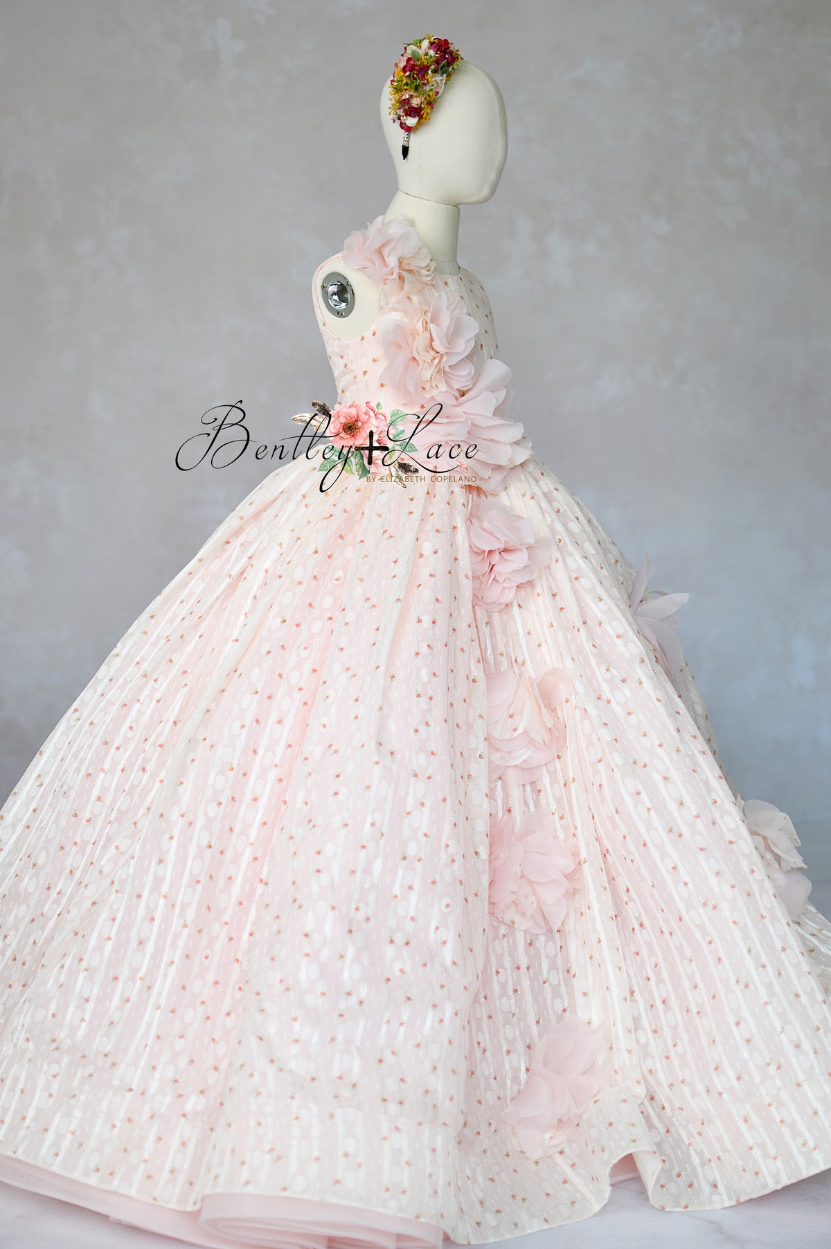 "Blush pink couture girls gown with 3D floral appliqués and full skirt"

