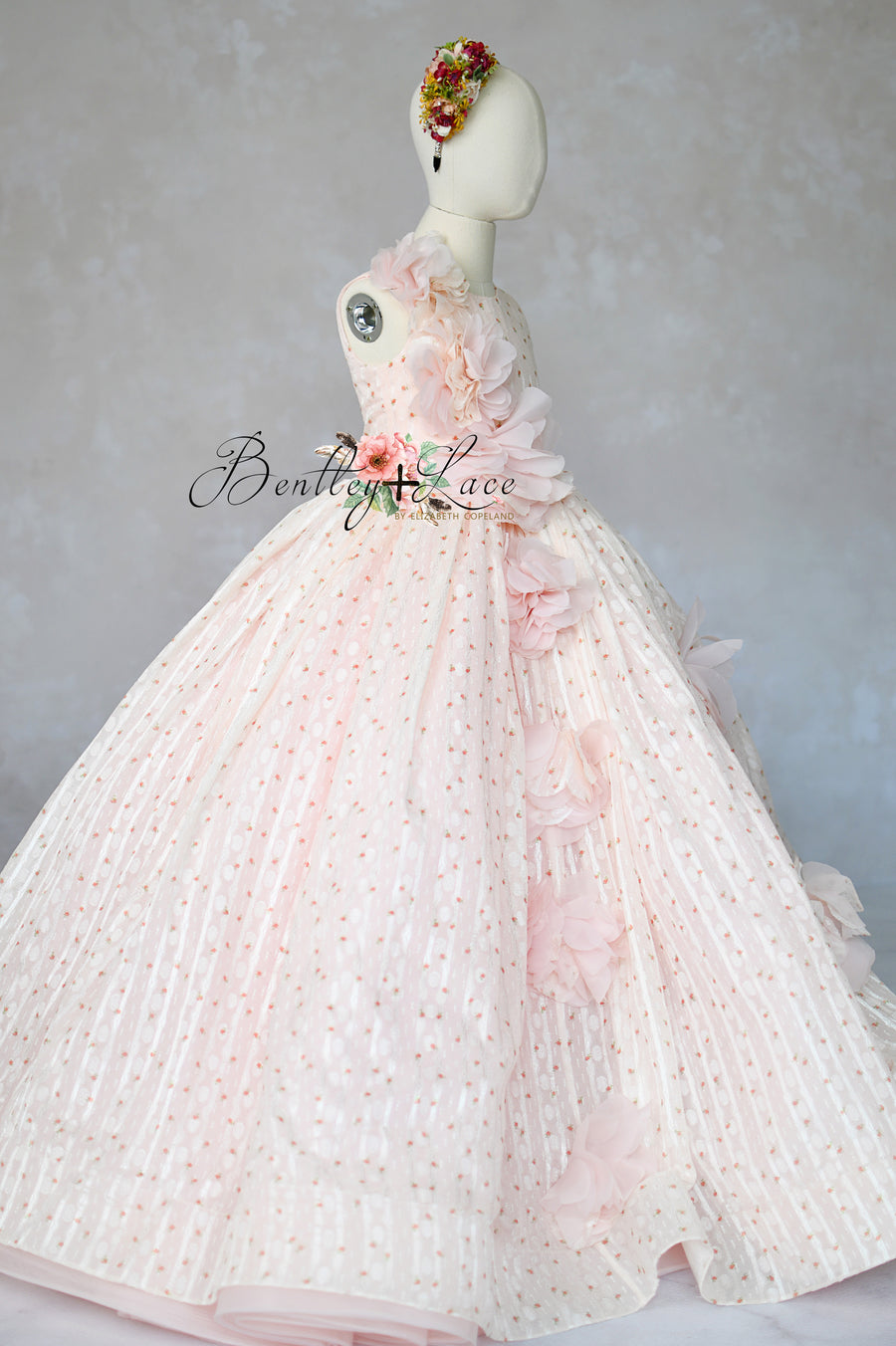 "Blush pink couture girls gown with 3D floral appliqués and full skirt"

