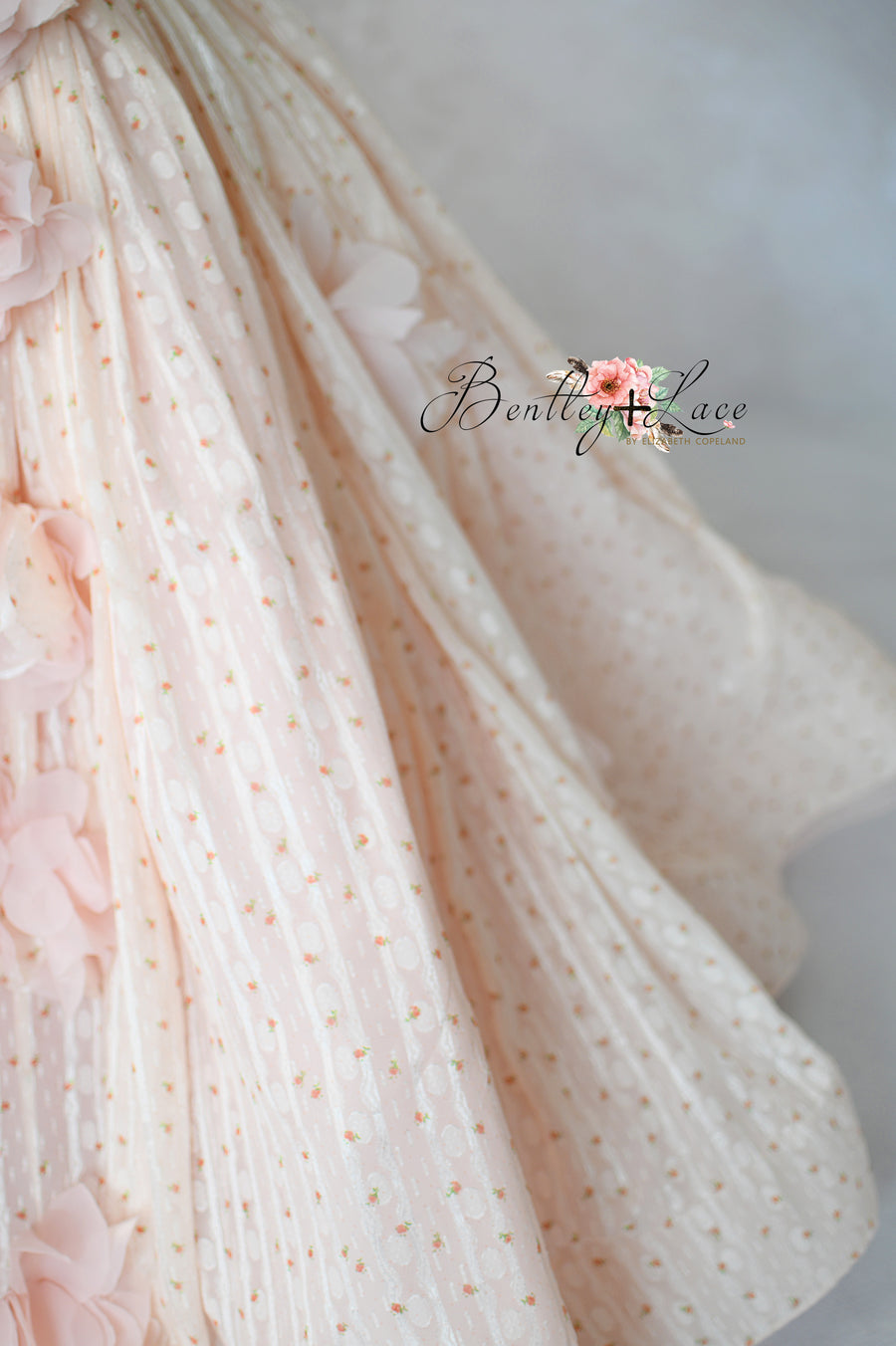 "Designer ball gown for girls in blush with textured polka dot fabric"

