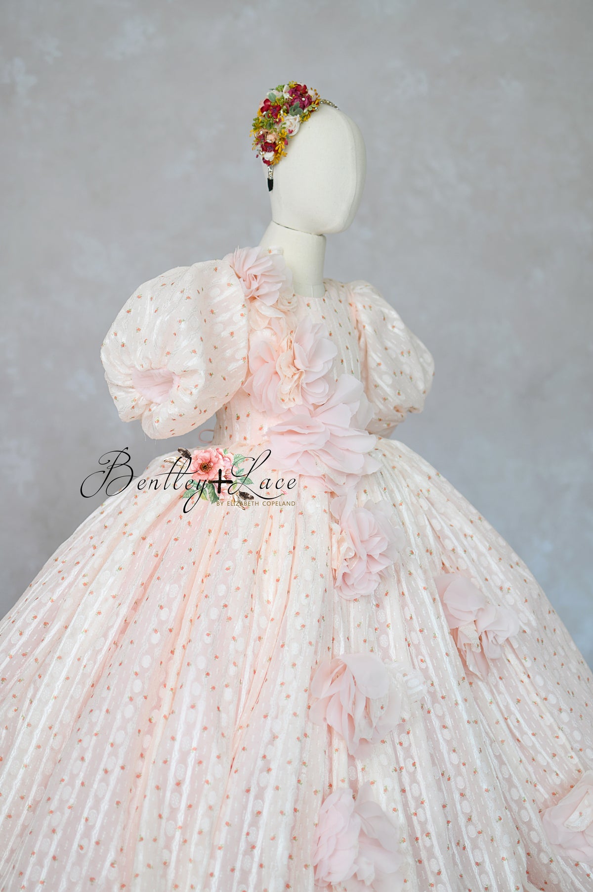"Blush pink couture girls gown with 3D floral appliqués and full skirt"

