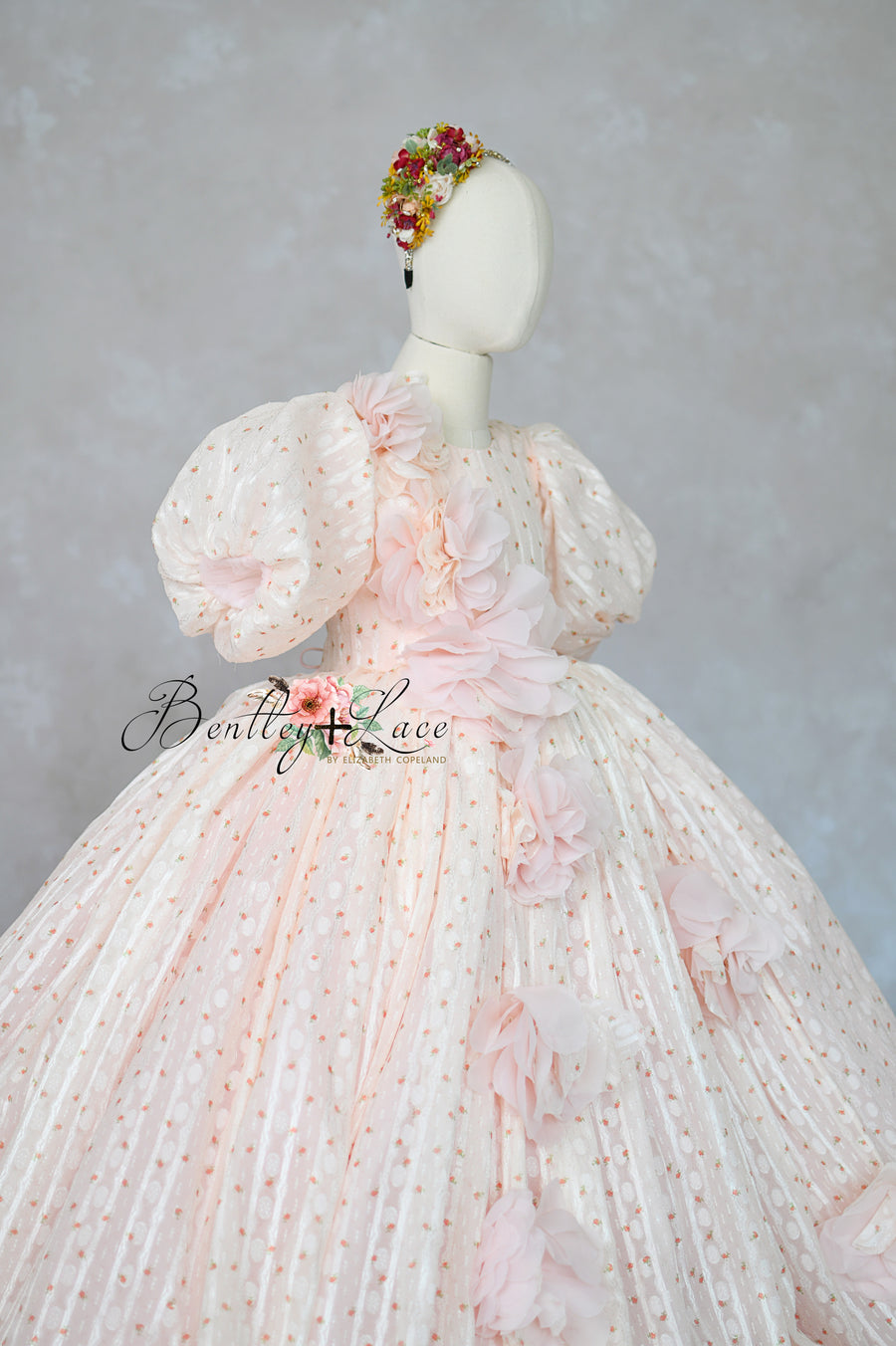 "Blush pink couture girls gown with 3D floral appliqués and full skirt"

